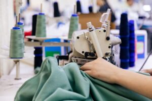 tailor-working-on-electric-sewing-machine-2023-11-27-05-09-01-utc